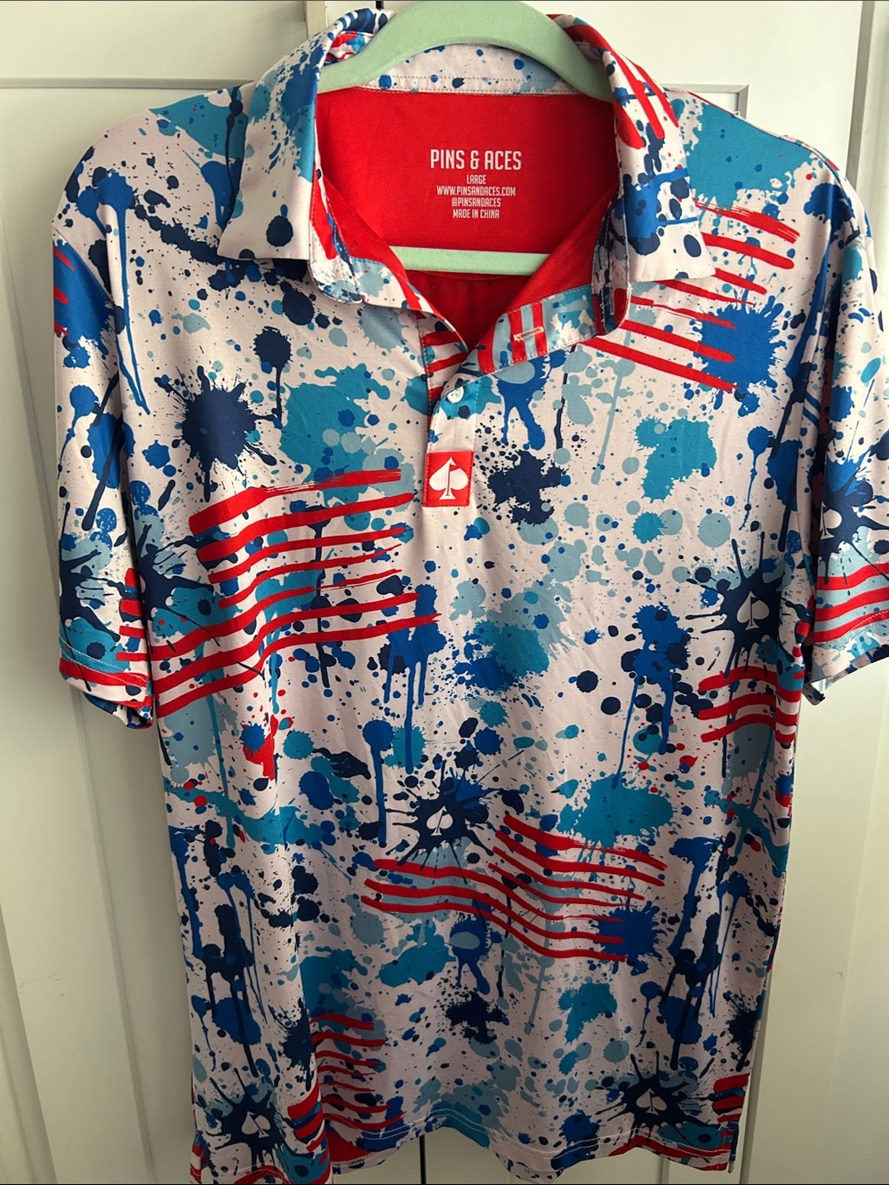 Pins & Aces Men’s Red and Blue Splash-Print Polo